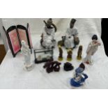 Selection of oriental items to include two mud men figures, resin dragon and buddha figures etc