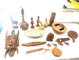 Selection of African and other wooden carvings to include masks, figures etc