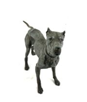 Spelter dog figure, marked HK to collar, 12 inches wide 7.5 inches wide