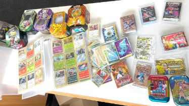 Large selection of assorted pokemon cards, packets etc. the packets are open and empty