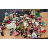 Large selection of assorted vintage small souvenir dolls