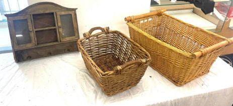 Two large wicker baskets and a vintage wooden wall hanging cabinet largest measures 11 inches long