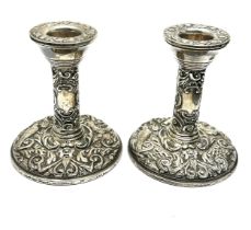 Pair of silver candlesticks filled base