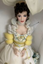2 boxed Franklin mint collectors dolls, both on plinths, approximate height: 18 inches including