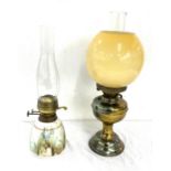 2 vintage oil lamps, comprising of a brass and Welford pottery piece, funnel to one needs replacing