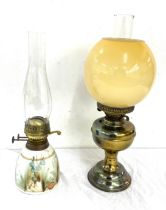 2 vintage oil lamps, comprising of a brass and Welford pottery piece, funnel to one needs replacing