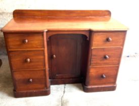 Mahogany 6 drawer, 1 door knee hole desk, approximate measurements: Height 34 inches, Width 48
