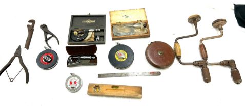 Large selection vintage and later measuring instruments to include tape measures, rulers etc