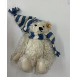 Steiff teddy bear in original box and tag, Winter with hat and scarf, 18cm tall