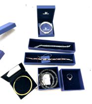 5 boxed Swarovski jewellery pieces to include rings, necklaces, bangle etc