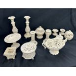 Selection of matching pottery pieces includes candle sticks, vases etc