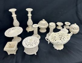 Selection of matching pottery pieces includes candle sticks, vases etc