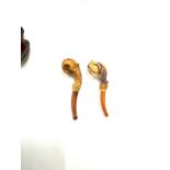 2 cased amber stem, bird claw detailing smoking pipes