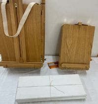2 wooden portable easels to include a desk easel, 3 blank canvases, approximate measurements: Height
