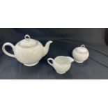 Three pieces of Royal Doulton paramount platinum a tea pot, sugar bowl and milk jug