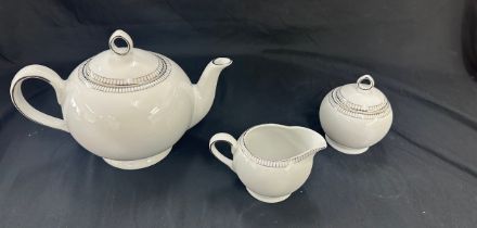 Three pieces of Royal Doulton paramount platinum a tea pot, sugar bowl and milk jug