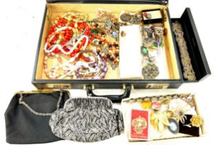 Briefcase containing a selection of costume jewellery