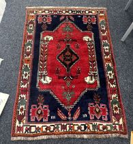 Vintage patterned rug measures approx 63 inches long by 42 inches wide