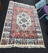 Large lounge rug measures approximately 77 inches long 55 inches wide