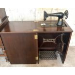 Cased Singer treadle sewing machine, untested