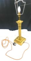 Vintage brass column based lamp measures approx 26 inches tall