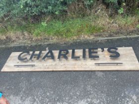 Large advertising "Charlies" sign, measures approximately 95 inches long 19 inches depth