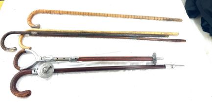 2 Silver topped walking sticks, 2 shooting sticks and 1 other