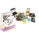 Large selection of assorted costume jewellery includes beads earrings etc