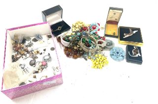 Large selection of assorted costume jewellery includes beads earrings etc