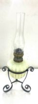 Antique wrought iron and Vasaline glass oil lamp, 22 inches tall