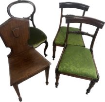 Four antique dining room/hall chairs two in need of repair