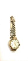 9ct gold framed revue watch with a rolled gold strap