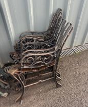 Four pairs of cast iron chair ends