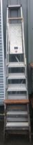 Two aluminium step ladders tallest measures approx 100 inches