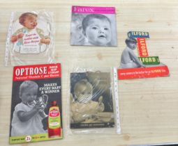 Selection of vintage child advertising signs on card largest measures 13 inches long