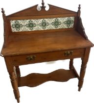 One drawer pine tile back wash stand measures approx 43 inches tall by 35 inches wide and 18