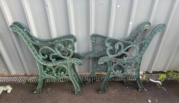 Two matching pairs of cast iron bench ends