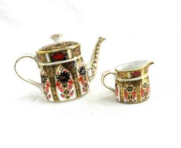 Boxed Royal Crown Derby old Imari miniature teapot and cream jug, 1128