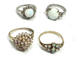 Four silver rings set with Opal (10g)