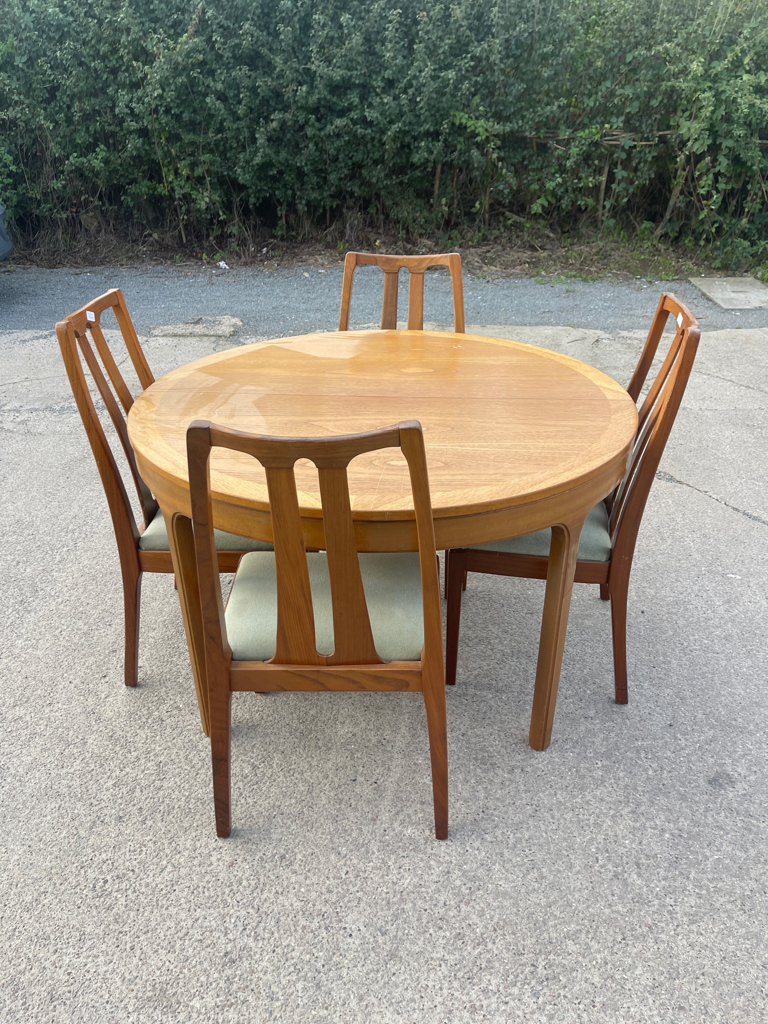 Mid century teak Nathan extending table and 4 chairs table measures approximately 48 inches