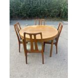 Mid century teak Nathan extending table and 4 chairs table measures approximately 48 inches