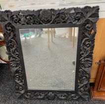 Carved wall hanging mirror, measures approximately 33 inches tall 27 inches wide