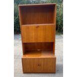 Retro teak jasper 2 door 1 drop down cabinet measures approximately 71 inches tall 19.5 inches depth