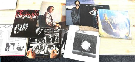 Selection of assorted records includes Paul Simon, Eric Clapton, Super Tramps etc