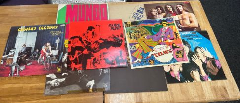 Selection of assorted records includes Status Quo, The Beatles, the Rolling Stones, The Who etc