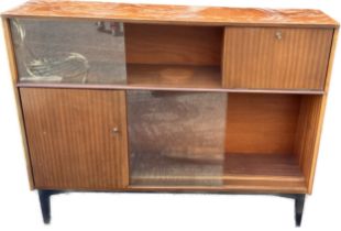 1960s Nathan Walnut cocktail cabinet with sliding glass doors, measures approximately 39 inches tall