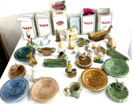 Large selection of Wade pottery to include lady figures, animals etc, all in good overall