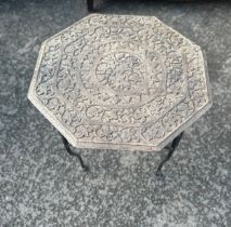 Vintage metal carved top octagonal occassional table measures approx 18 inches tall