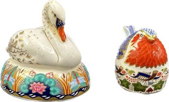 Two Royal Crown Derby Paperweights, White Swan nesting and Robin Nesting, both with silver