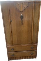 Oak tall boy 2 door 1 door measures approximately 57 inches tall 29.5 inches wide 15.inces depth